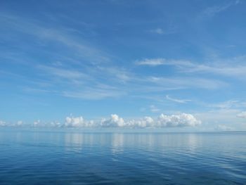 Scenic view of sea against blue sky