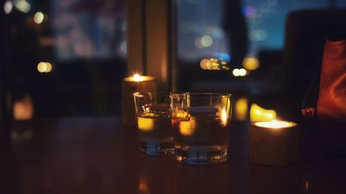 Close-up of tea light candles on table