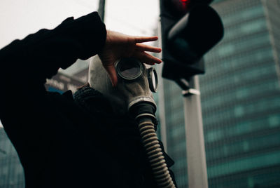 Midsection of person holding umbrella