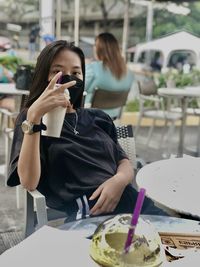 Young woman drinking coffee