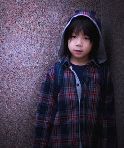 Boy standing in corridor