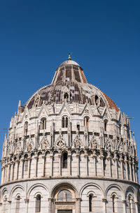 Low angle view of historic building against clear blue sky