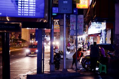 People on city street at night