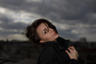 Side view of young woman looking away