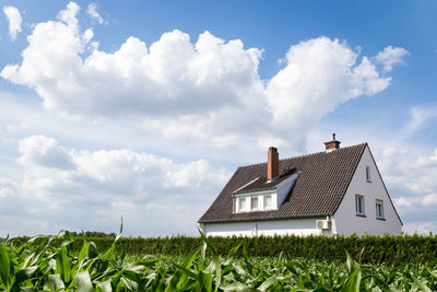 House on field against sky