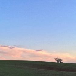 Scenic view of landscape against sky at sunset