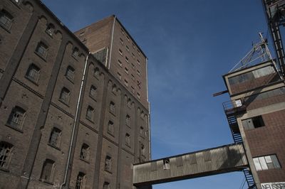 Low angle view of building against blue sky