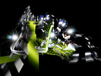 Close-up of illuminated light painting against black background
