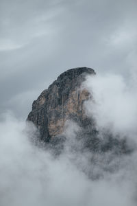 Low angle view of smoke emitting from volcanic mountain against sky