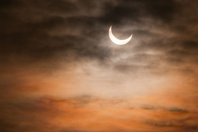 Low angle view of moon against sky at night