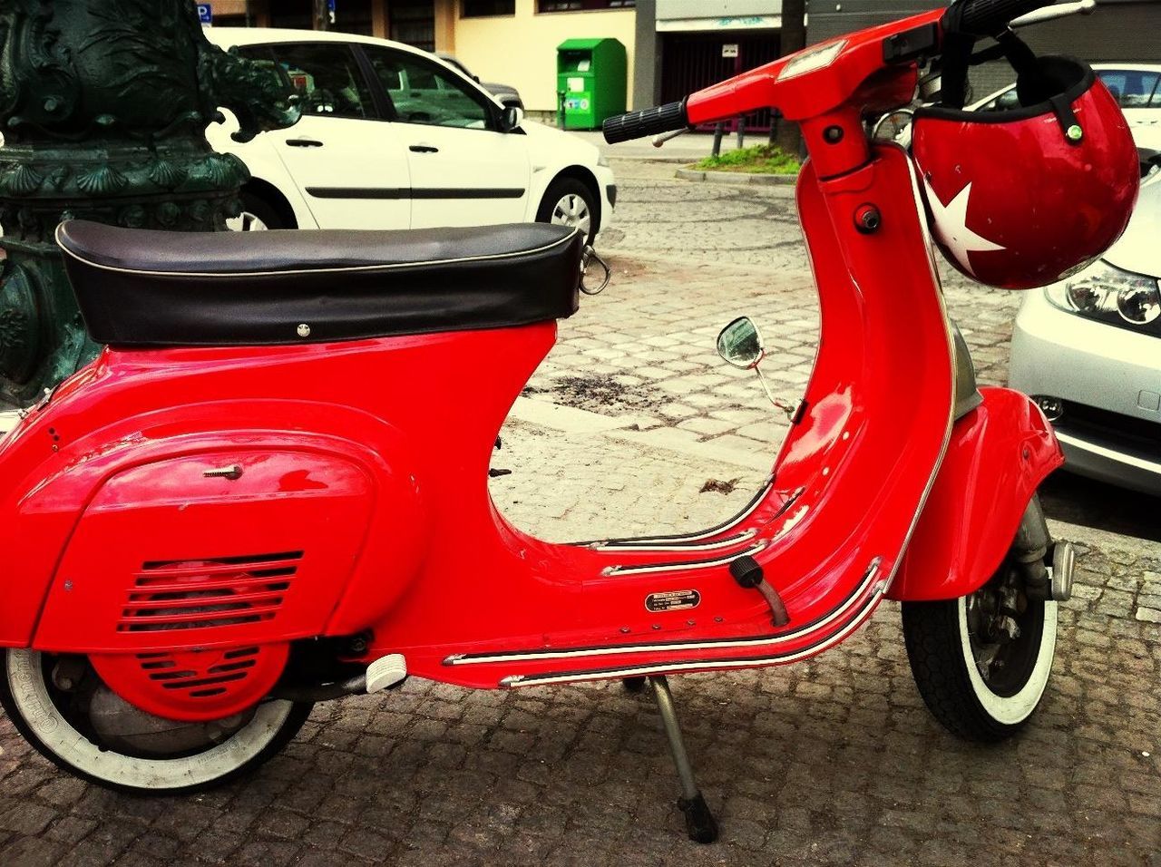 red, transportation, land vehicle, mode of transport, car, stationary, parking, street, travel, parked, wheel, outdoors, bicycle, day, parking lot, no people, close-up, absence, road, sidewalk