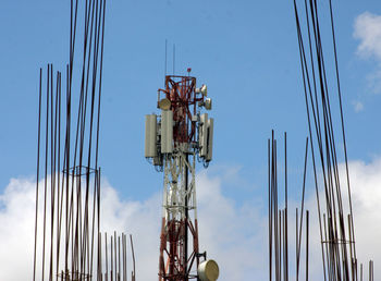 Low angle view of crane against sky