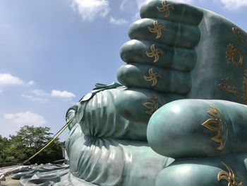 Low angle view of statue against sky