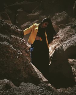 Woman standing on rock