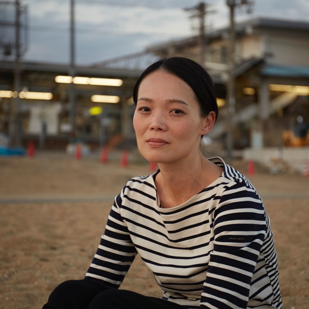 portrait, person, lifestyles, focus on foreground, front view, casual clothing, leisure activity, confidence, headshot, outdoors, day, close-up, selective focus