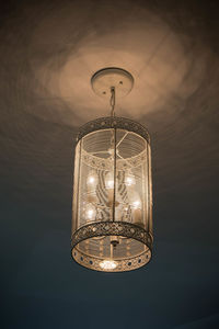 Low angle view of illuminated pendant light on ceiling