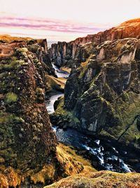 Scenic view of river against sky during sunset