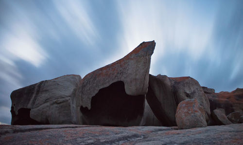 Low angle view of rock formation against sky