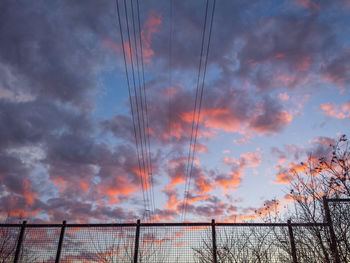Low angle view of cloudy sky at sunset