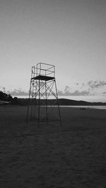 Lifeguard hut on beach against sky