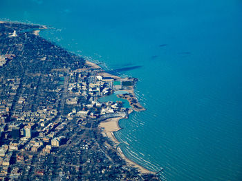 High angle view of city by sea