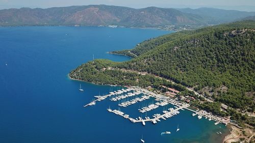 High angle view of sea against mountains