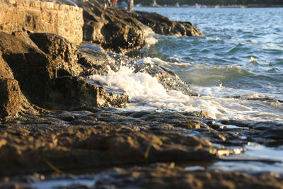 Waves splashing on rocks at beach