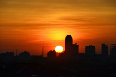 Silhouette of city at sunset