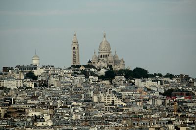 Buildings in city against sky