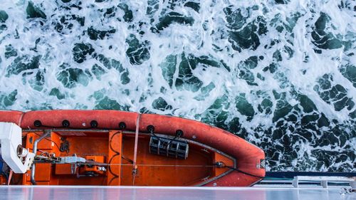 Close-up of red boat in sea