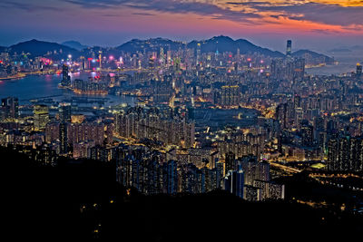 High angle view of illuminated city buildings at night