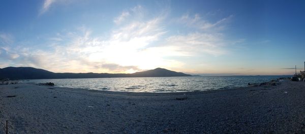 Scenic view of sea against sky at sunset