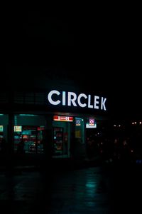 Information sign in illuminated city at night