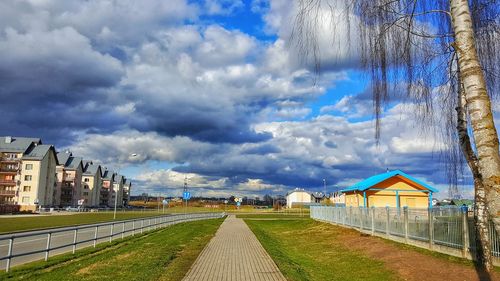 View of buildings against cloudy sky