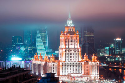 Illuminated buildings in city at night