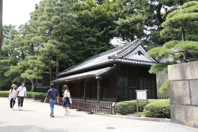 People walking outside temple