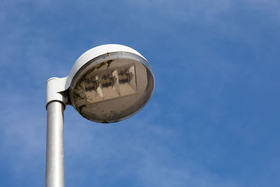 Low angle view of street light against sky