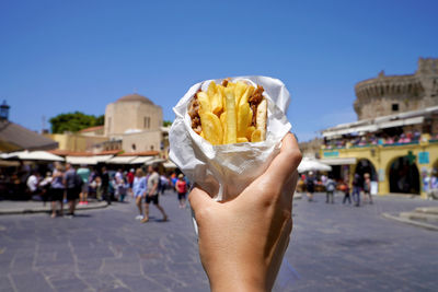 Pita gyros. greek gyros wrapped in pita breads against greek old city square.