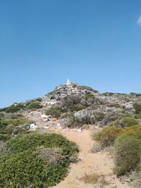 Scenic view of mountains against clear blue sky