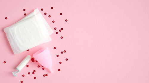 High angle view of ice cream against pink background