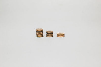 Close-up of coins on white background