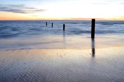 Scenic view of sea at sunset