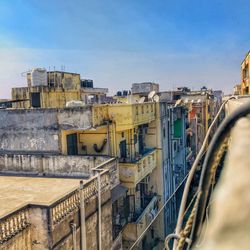 High angle view of buildings against blue sky