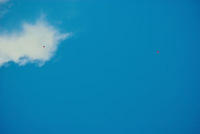 Low angle view of helicopter against sky