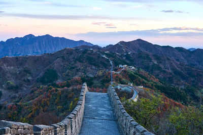 Scenic view of mountains against cloudy sky