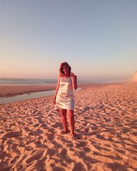 Woman standing on beach