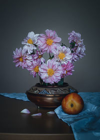 Close-up of flowers in vase on table