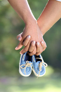 Close-up of couple holding hands