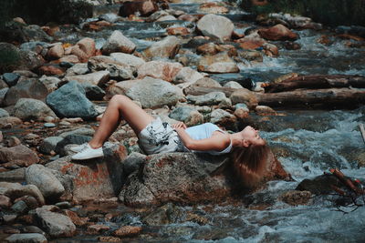 High angle view of woman on rocks