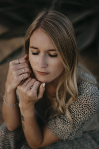 Portrait of a young woman sitting outdoors